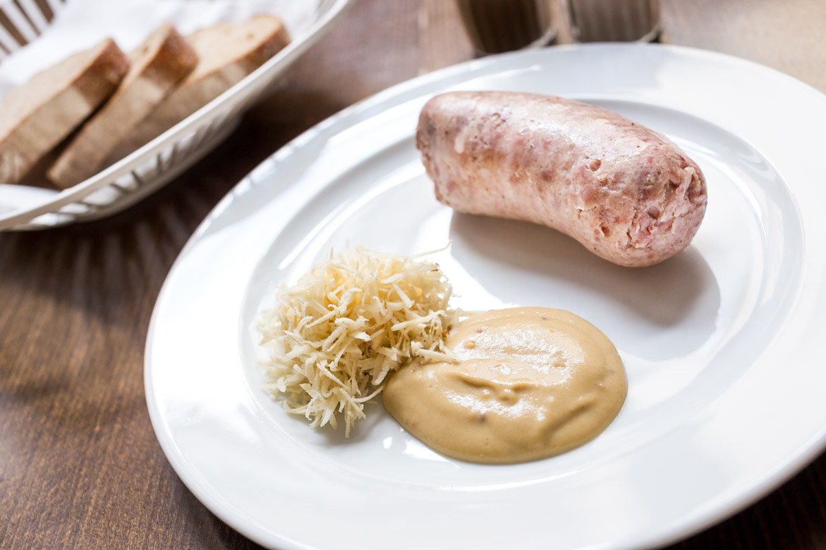 Homemade “Talián” sausage with grated horseradish and mustard
